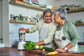 Elderly couple cooking